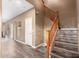 Interior view of a wood staircase, complemented by neutral walls and wood-style laminate flooring at 2635 E Chester Dr, Chandler, AZ 85286