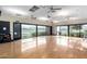 Spacious dance/aerobics room featuring wood floors, a wall of mirrors, and pond views at 2748 E Cherry Hill Dr, Gilbert, AZ 85298