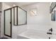 Bright bathroom featuring a large soaking tub and enclosed shower with glass at 2748 E Cherry Hill Dr, Gilbert, AZ 85298