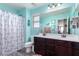 Bright bathroom with dual sinks, wood cabinets, and charming nautical decor at 2748 E Cherry Hill Dr, Gilbert, AZ 85298