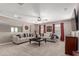 Bright living room featuring neutral walls, carpet flooring, a ceiling fan, and comfortable seating arrangement at 2748 E Cherry Hill Dr, Gilbert, AZ 85298