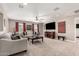 Bright living room featuring neutral walls, carpet flooring, a ceiling fan, and comfortable seating arrangement at 2748 E Cherry Hill Dr, Gilbert, AZ 85298