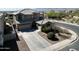 Aerial view of a two-story home with a long driveway and meticulously maintained landscaping in a residential area at 2811 W Glenhaven Dr, Phoenix, AZ 85045