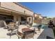 Inviting backyard with pool, fire pit, and ample seating at 2811 W Glenhaven Dr, Phoenix, AZ 85045