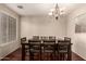 Traditional dining room features a chandelier and ample seating for Gathering gatherings at 2811 W Glenhaven Dr, Phoenix, AZ 85045