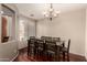 Traditional dining room features a chandelier and ample seating for Gathering gatherings at 2811 W Glenhaven Dr, Phoenix, AZ 85045