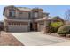 Charming two-story home featuring a neutral palette, landscaped front yard, and a two-car and a one-car garage at 2811 W Glenhaven Dr, Phoenix, AZ 85045