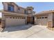 Charming two-story home featuring a neutral palette, landscaped front yard, and two spacious garages at 2811 W Glenhaven Dr, Phoenix, AZ 85045