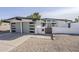 Attractive single-story home featuring a modern garage door with windows and a gated front entry at 2925 E North Ln, Phoenix, AZ 85028