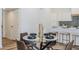 Cozy dining space with a view of the modern kitchen, complete with sleek cabinets and stylish backsplash at 2925 E North Ln, Phoenix, AZ 85028