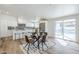 Modern kitchen and dining area with stainless steel appliances and an inviting view of the sparkling pool at 2925 E North Ln, Phoenix, AZ 85028