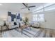 Bright, open-concept living room with modern furnishings and a view of the front yard at 2925 E North Ln, Phoenix, AZ 85028