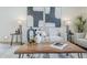 Bright living room with modern furniture, stylish decor, and contemporary artwork displayed on the wall at 2925 E North Ln, Phoenix, AZ 85028