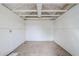 Inside empty white storage shed with concrete floor and open ceiling beams at 2925 E North Ln, Phoenix, AZ 85028