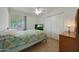 Bedroom featuring tile floors, window and closet with white doors at 3333 N 81St Ave, Phoenix, AZ 85033