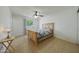 A bedroom with tile floors, a ceiling fan and a window to bring in natural light at 3333 N 81St Ave, Phoenix, AZ 85033