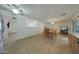 Dining room with tile floors and adjacent kitchen at 3333 N 81St Ave, Phoenix, AZ 85033