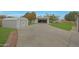 Long driveway leading to a detached garage, providing ample parking space at 3333 N 81St Ave, Phoenix, AZ 85033