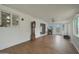 Enclosed patio area with tile flooring, lots of windows and a vintage grandfather clock at 3333 N 81St Ave, Phoenix, AZ 85033