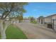 Driveway and yard leading to a detached garage on the property at 3333 N 81St Ave, Phoenix, AZ 85033