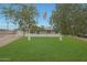 Charming single-story home featuring a well-manicured lawn and a prominent American flag at 3333 N 81St Ave, Phoenix, AZ 85033