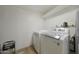 View of an indoor laundry room featuring a white washer, dryer and storage space at 3333 N 81St Ave, Phoenix, AZ 85033