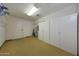 Large storage room features carpeted floor, full wall of storage, door and shelving at 3333 N 81St Ave, Phoenix, AZ 85033