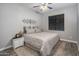 Neutral bedroom featuring a king-size bed, nightstand, and carpet flooring at 3518 S Posse Trl, Gilbert, AZ 85297