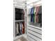 Custom closet system featuring rods and shelves for optimal organization and clothing storage at 3518 S Posse Trl, Gilbert, AZ 85297