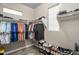 Organized walk-in closet featuring ample hanging space and shoe storage at 3518 S Posse Trl, Gilbert, AZ 85297