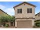 Tan two-story home with a brown garage door and manicured front yard at 3518 S Posse Trl, Gilbert, AZ 85297