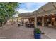 Expansive backyard with covered patio, seating areas, and mature landscaping, creating an ideal outdoor living space at 3544 N 149Th Ave, Goodyear, AZ 85395