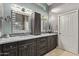 Beautiful bathroom featuring a double vanity with modern fixtures and ample storage at 3544 N 149Th Ave, Goodyear, AZ 85395