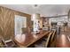 Warm dining room with stylish lighting, leading to a modern kitchen in an open layout at 3544 N 149Th Ave, Goodyear, AZ 85395