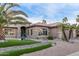 The home's exterior shows desert landscaping, stonework accents and a blue front door at 3544 N 149Th Ave, Goodyear, AZ 85395