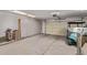 Clean garage with white cabinets and a golf cart at 3544 N 149Th Ave, Goodyear, AZ 85395