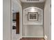 Hallway with decorative art niche and views into the bedroom, creating a cozy and inviting space at 3544 N 149Th Ave, Goodyear, AZ 85395