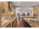 Spacious kitchen featuring granite countertops, stainless steel appliances, and hardwood floors at 3544 N 149Th Ave, Goodyear, AZ 85395