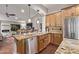 Bright kitchen with stainless steel appliances, granite countertops, and wooden cabinetry at 3544 N 149Th Ave, Goodyear, AZ 85395