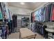 Spacious walk-in closet with custom shelving and ample hanging space at 3544 N 149Th Ave, Goodyear, AZ 85395