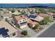 Aerial view of the neighborhood highlighting the home with solar panels and a sparkling pool at 3614 W Alyssa Ln, Phoenix, AZ 85083