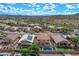 Aerial view of a desert community featuring a home with a sparkling pool and landscaped yard at 3614 W Alyssa Ln, Phoenix, AZ 85083