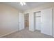 Comfortable bedroom with a ceiling fan, closet, and attached room at 3614 W Alyssa Ln, Phoenix, AZ 85083