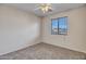 Cozy bedroom with plush carpeting and a window offering scenic views at 3614 W Alyssa Ln, Phoenix, AZ 85083