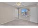 Cozy bedroom with a ceiling fan and large bright window at 3614 W Alyssa Ln, Phoenix, AZ 85083