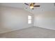 Bedroom featuring a ceiling fan, carpet floors, and a window with blinds at 3614 W Alyssa Ln, Phoenix, AZ 85083