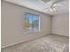 Bedroom featuring carpet floors, ceiling fan, and large window with blinds at 3614 W Alyssa Ln, Phoenix, AZ 85083