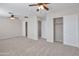 Bonus room with carpet, closets, ceiling fans, and natural light at 3614 W Alyssa Ln, Phoenix, AZ 85083