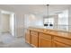 Hallway with a built-in cabinet and modern light fixture at 3614 W Alyssa Ln, Phoenix, AZ 85083