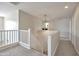 Spacious second floor hallway featuring neutral tones and modern lighting fixture at 3614 W Alyssa Ln, Phoenix, AZ 85083